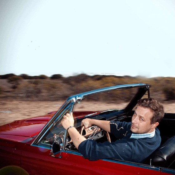 Brad E. Bailey in a convertible
