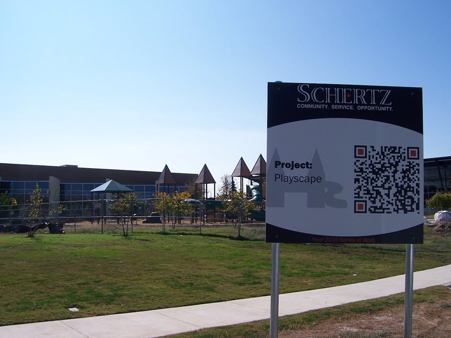 A project sign for the Playscape, with a QR code.
